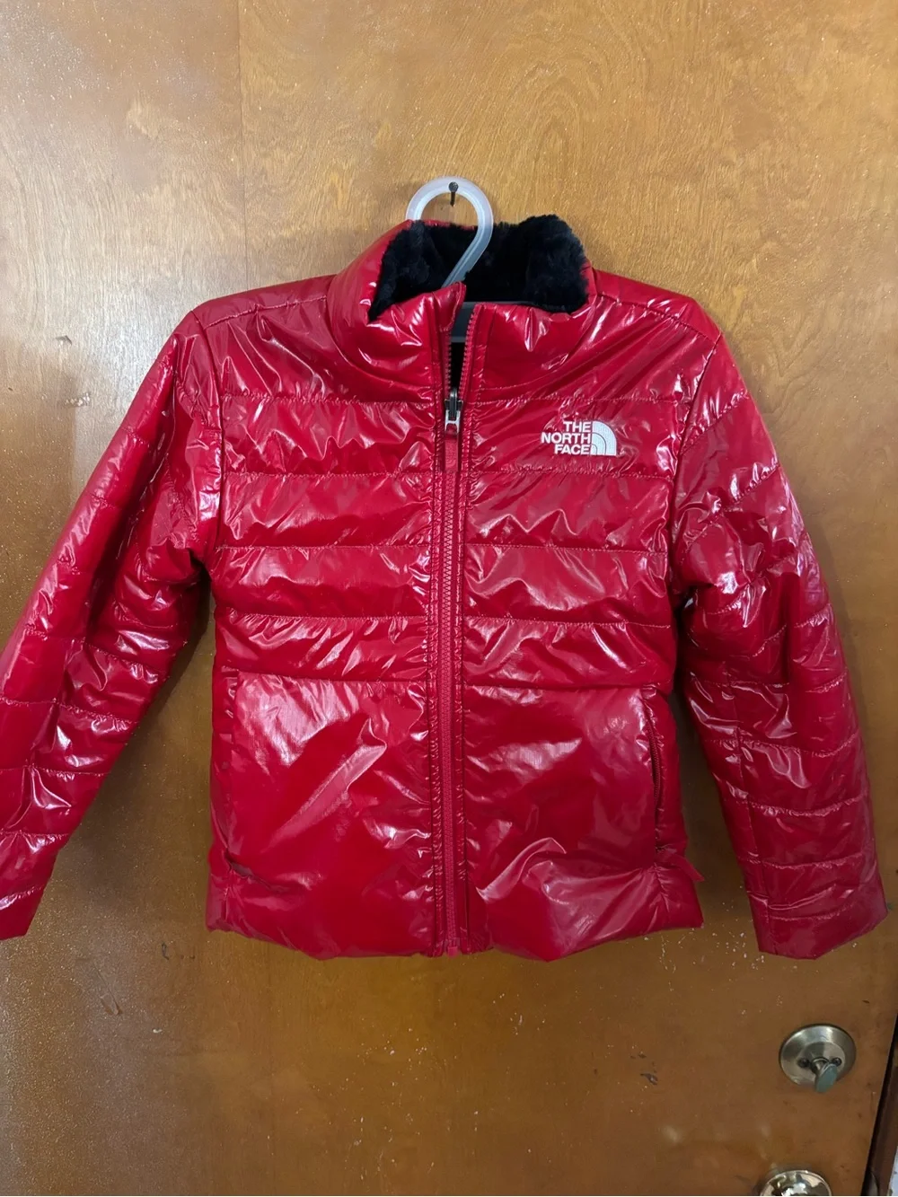 The North Face coat.  Girls. Red reversible